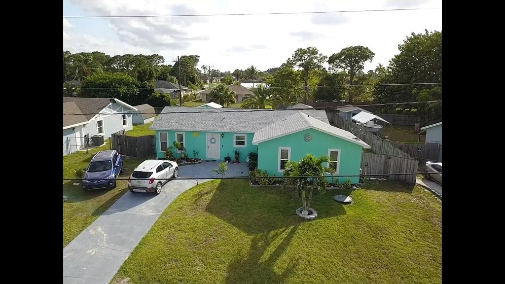 Photo of 2094 SW Idaho Lane, Port Saint Lucie, FL 34953 (MLS # R10798963)
