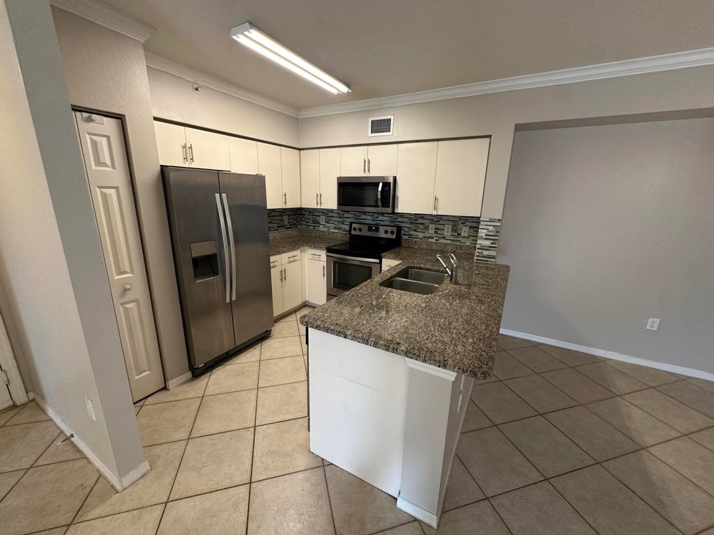 Photo of 6370 Emerald Dunes Drive #302, West Palm Beach, FL 33411 (MLS # R11139631)