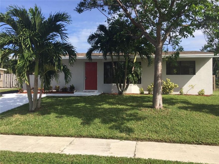 Want it all? This 4/2 is the perfect answer. 1380 Sq Ft of living space, beautiful remodeled bathrooms with designer tiles, wall to wall tile throughout, new kitchen and appliances with granite counter tops, mirrored closet doors,  finished patio room with gigantic fenced in back yard ideal for kids, pets or a new pool. Hurry and bring your DU approved buyers. This gem is in a high demand area and is now a polished diamond to cherish.