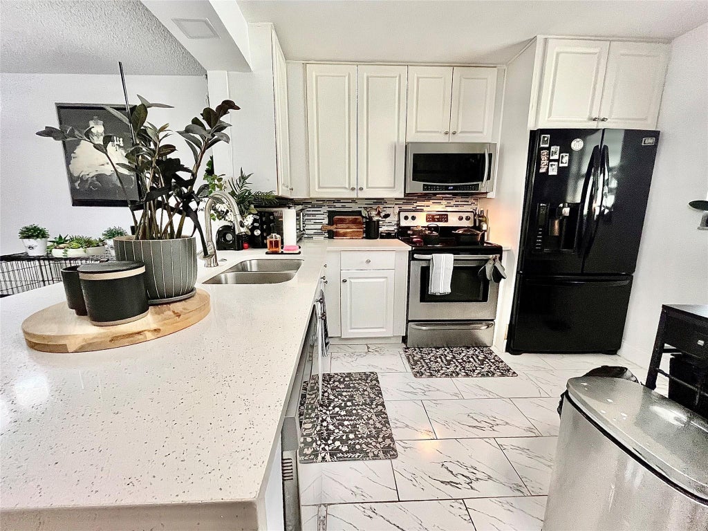 Photo of 8301 Sands Point Boulevard #306s, Tamarac, FL 33321 (MLS # B26057234)