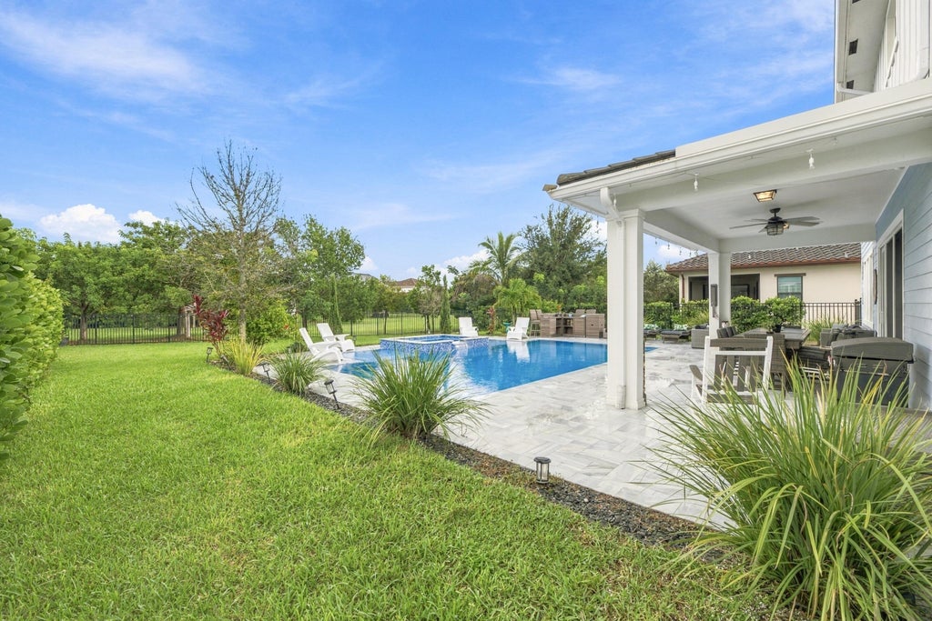 Photo of 1050 Sweetgrass Street, Loxahatchee, FL 33470 (MLS # B26090905)