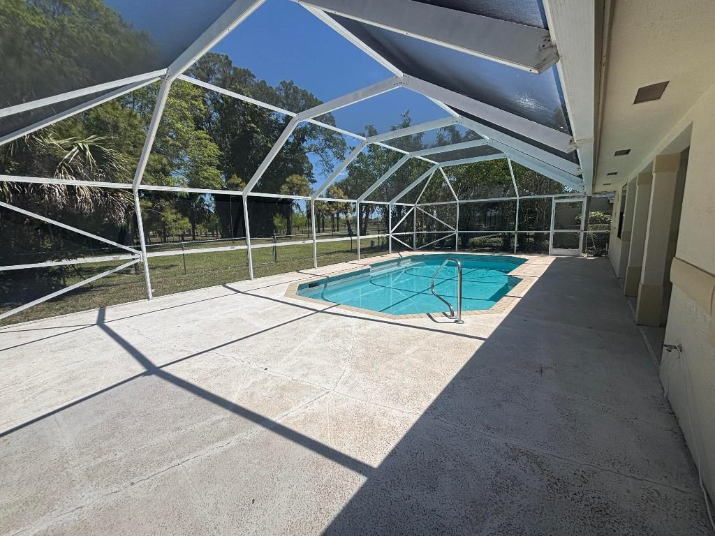 Photo of 123 Sandpiper Ave, Royal Palm Beach, FL 33411 (MLS # R11083331)