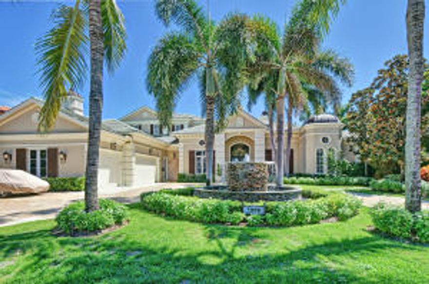 Located on a quiet street, this golf course home in Royal Palm Yacht & Country Club has one of the best views the community has to offer, overlooking 4 fairways (1st, 2nd, 3rd and 4th fairways) of the Jack Nicklaus Signature Golf Course. Built by Qualk Homes in 2001, this home has 5 bedrooms plus den, 6 full & 1 half bathrooms, 5,911 sqft under air, impact glass windows & doors and 3 car garage plus golf cart. 1st floor master suite features sitting area, his and her walk-in closets, his and her bathrooms and French doors leading to a covered patio area. Other features include gourmet kitchen w/ breakfast area, family room, billiard area w/ bar, summer kitchen, heated pool & spa, formal living room w/ fireplace, formal dining room w/ butler's pantry, and an upstairs loft area w/ sundeck.