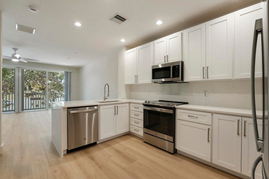 Photo of 3416 W Community Drive, Jupiter, FL 33458 (MLS # B26088730)