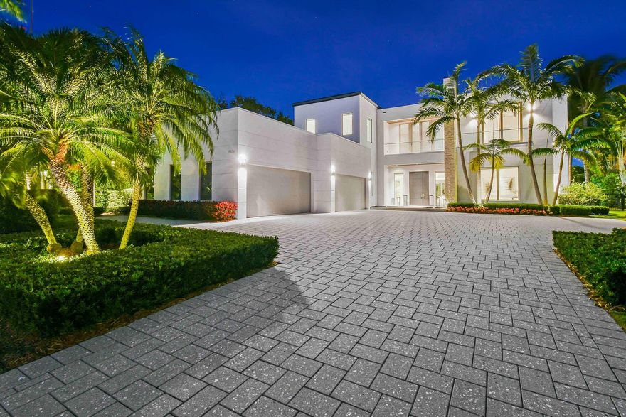 Nestled along the Intracoastal Waterway in the prestigious gated community of Harbor Place, this custom waterfront estate combines modern luxury with breathtaking views. Built by premier custom builder Couture Lifestyles Homes, this residence showcases expert craftsmanship with the highest level of detail and quality. Meticulously maintained at a level not often available. Situated on a generous 0.82-acre lot, the residence features 5 expansive bedrooms, 6 full bathrooms, and 3 half bathrooms, encompassing over 9,000 square feet of living space (10,000+ total). Its prime location provides direct water access, a private dock with a new 30,000 pound Hi-Tide lift, and a seamless connection to both land and sea. Constructed with reinforced CBS and tie-beam construction, extensive
