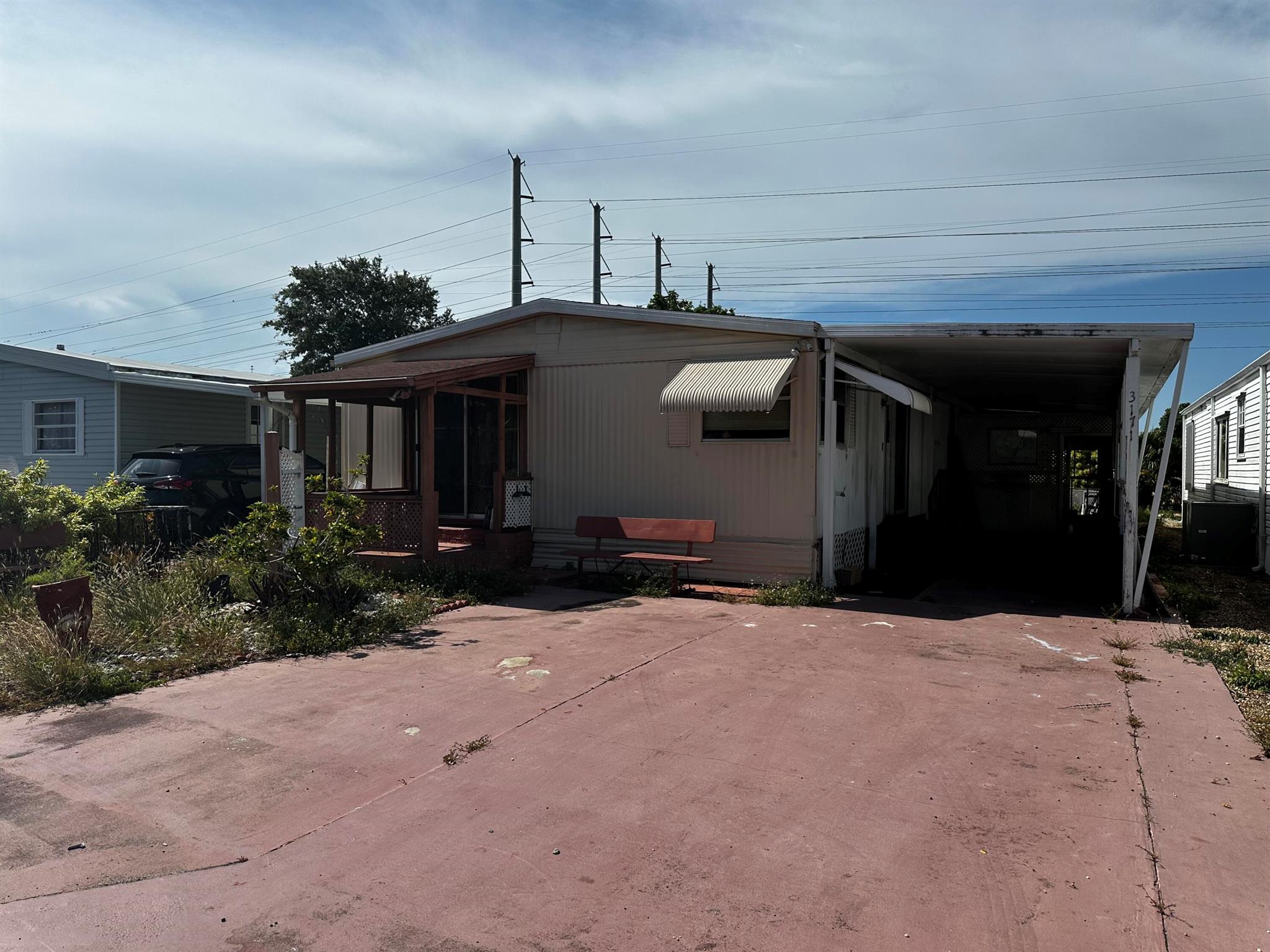 Opportunity to own a 4,378 sq ft lot in the Estates of Fort Lauderdale, Land-Owned, all-age community with low monthly fees and a wide array of amenities. The property currently features an original double-wide trailer that can be renovated, replaced with a newer model, or removed to build a new single-family home, subject to city and association approval. The community offers a vibrant lifestyle with amenities including a clubhouse, heated pool, fitness center, tennis and pickleball courts, basketball court, BBQ areas, petanque court, family playground, laundry facilities, and an on-site restaurant. Residents also enjoy regular community gathering events that bring neighbors together year-round. Property is being sold as-is. A one-time HOA capital contribution is due at purchase. Buyer