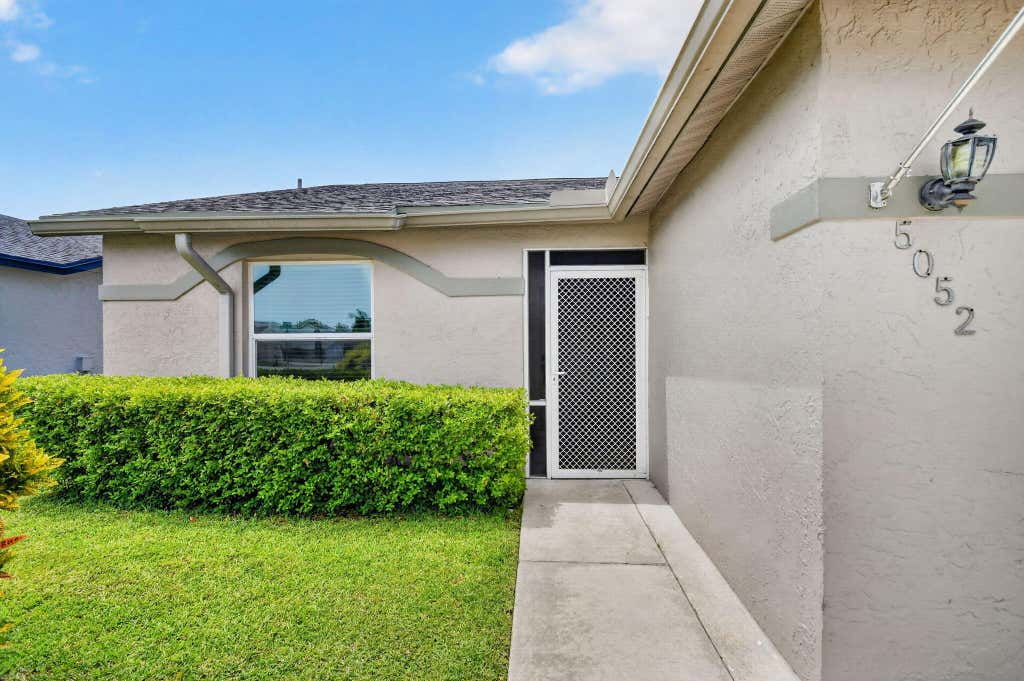 Photo of 5052 ARBOR GLEN Circle, Lake Worth, FL 33463 (MLS # B26051988)