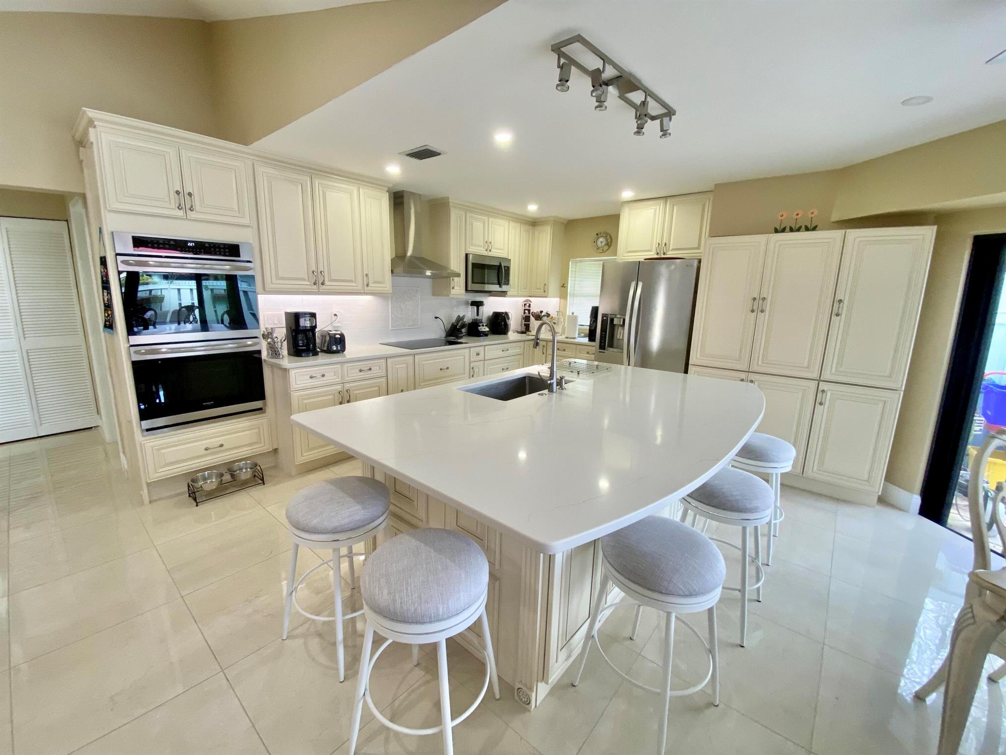 Enjoy the winter at one of Jupiter's premier beach side communities.  Bella Vista is located adjacent to Carlin Park trail leading directly to the beach. This beautifully renovated and expanded split 2 bedroom 2 full bath comes fully furnished, turnkey.  Private patio for bbq dinners or relaxing in the sun.  Community features heated pool, pickleball, tennis, and bocce.  2 assigned parking spots in front of villa.