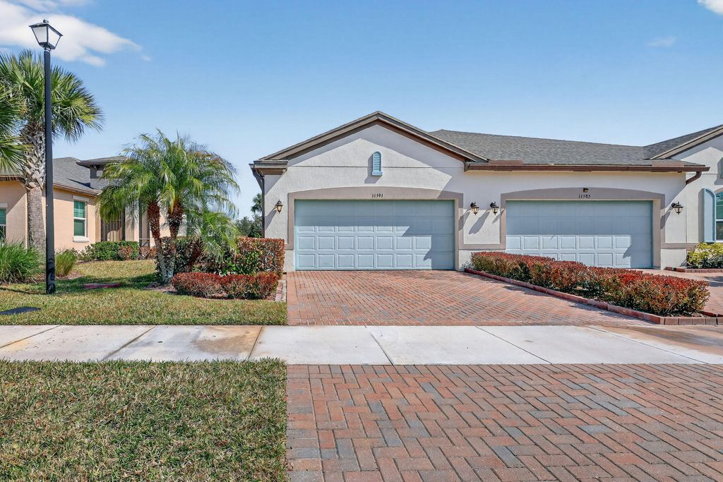 Photo of 11591 SW Lake Park Drive, Port Saint Lucie, FL 34987 (MLS # B26004593)