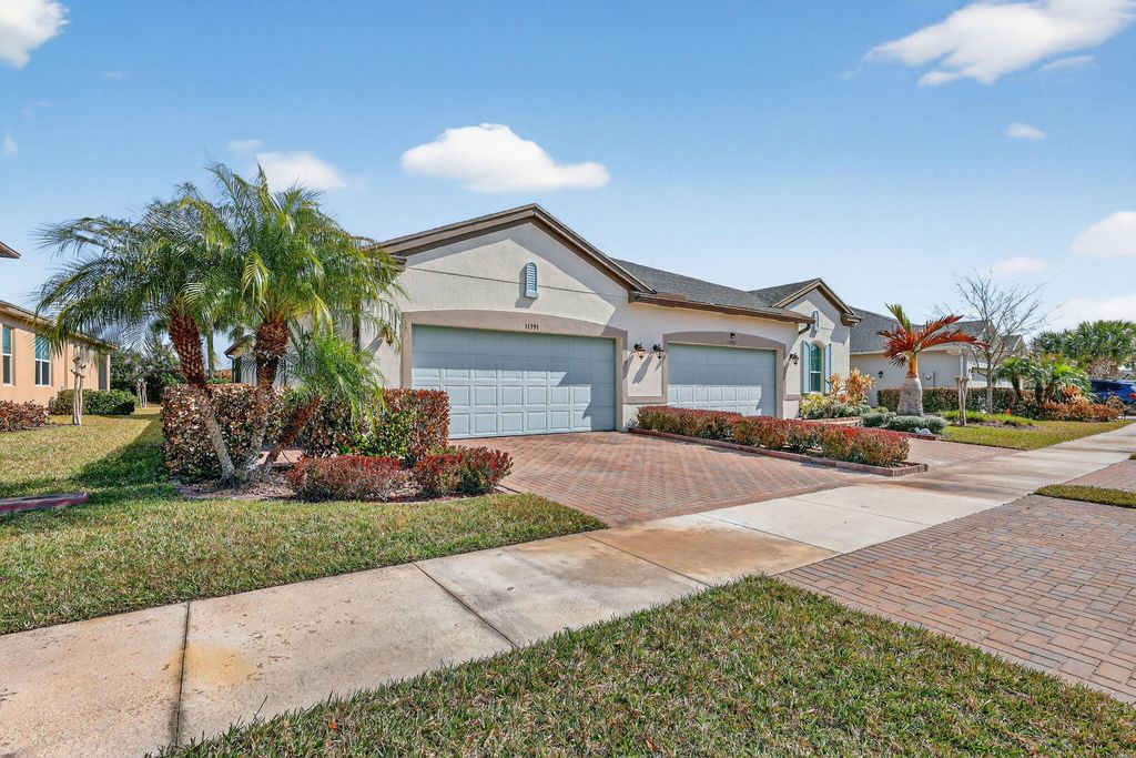 Photo of 11591 SW Lake Park Drive, Port Saint Lucie, FL 34987 (MLS # B26004593)