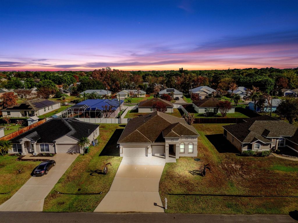 Photo of 1957 SW Logan Street, Port Saint Lucie, FL 34953 (MLS # B26004398)