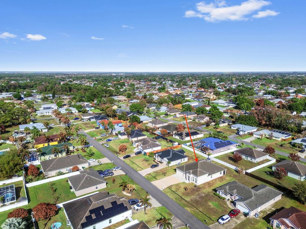 Photo of 1957 SW Logan Street, Port Saint Lucie, FL 34953 (MLS # B26004398)