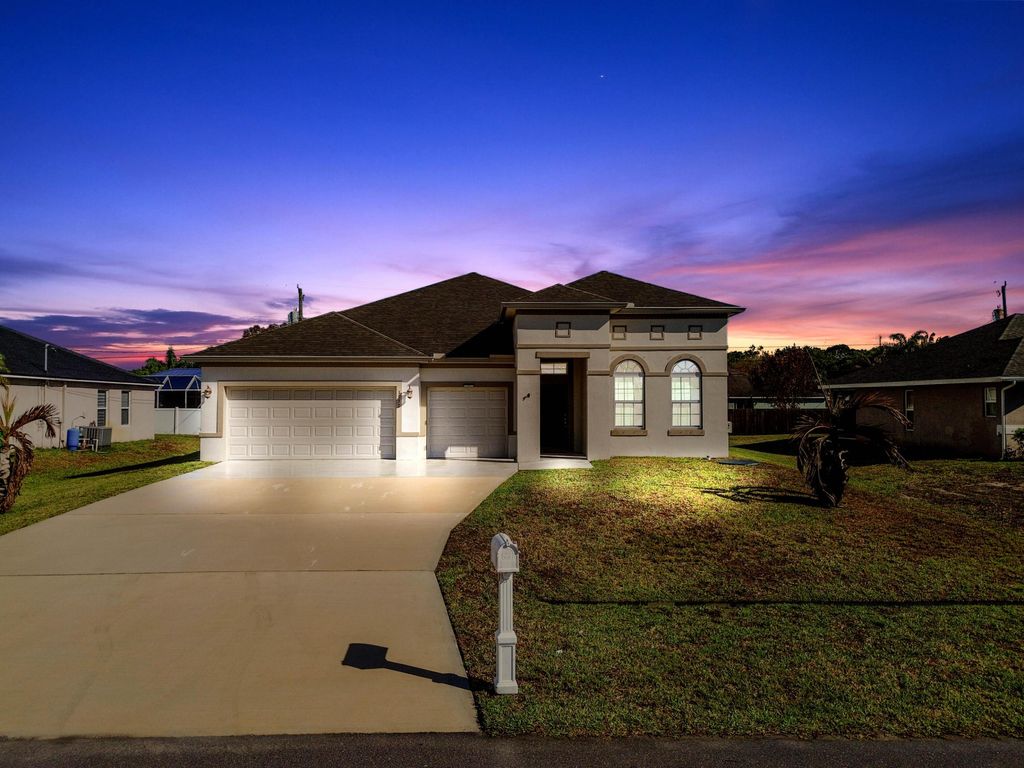 Photo of 1957 SW Logan Street, Port Saint Lucie, FL 34953 (MLS # B26004398)