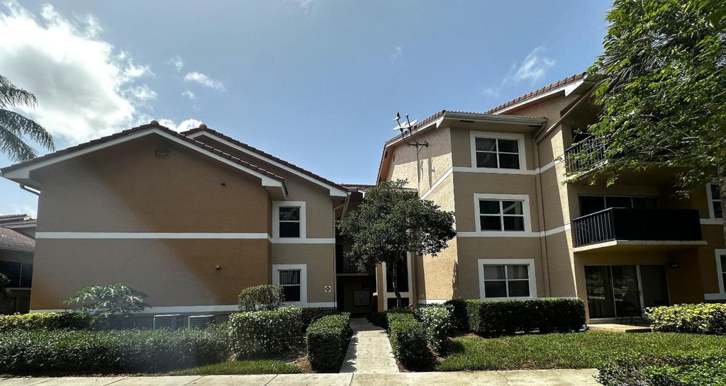 Photo of 8955 Wiles Rd #102, Coral Springs, FL 33067 (MLS # R11097382)