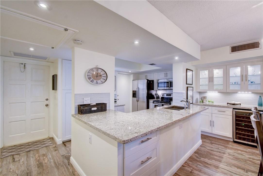 Seasonal rental available Jan 1, 2026! Fully renovated unit with stunning golf course views. Open kitchen features white cabinetry, granite counters, and stainless steel appliances. Bright Florida room/den offers extra living space. Community amenities include a heated pool, laundry on each floor, and one assigned parking space. Prime location near beaches, shopping, dining, and major highways. Top-of-the-line finishes throughout—perfect for your winter getaway!