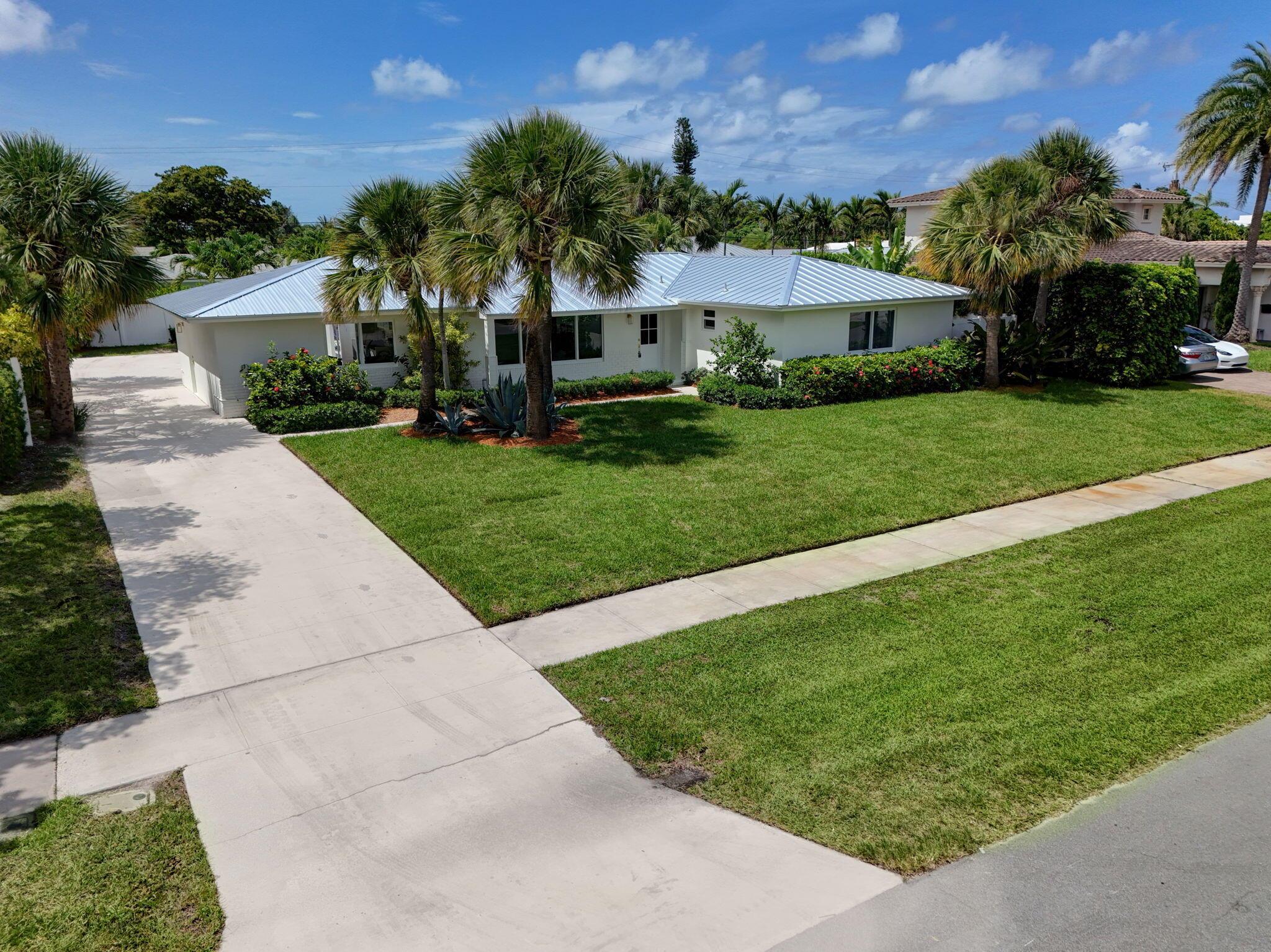 Welcome to your dream residence in the heart of prestigious North Palm Beach. This beautifully appointed single-story home blends timeless elegance with modern comfort, featuring 3 bedrooms, a den, 2 designer bathrooms, and a 2-car garage. The gourmet kitchen is a culinary masterpiece with quartz countertops and top-of-the-line appliances -- perfect for both casual dining and sophisticated entertaining. Step outside to your private backyard oasis, where a stunning pool invites you to bask in the Florida sun or host unforgettable gatherings. Ideally situated in a serene neighborhood, just moments from Lakeside Park, pristine beaches, the North Palm Beach Country Club, fine dining, and only 15 minutes from Palm Beach International Airport -- this is luxury coastal living at its finest