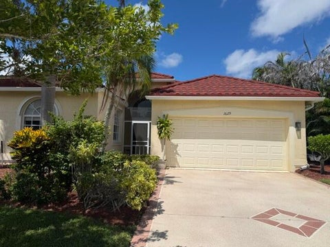 Photo of 1629 SE SHELBURNIE Way, Port Saint Lucie, FL 34952 (MLS # B26079149)