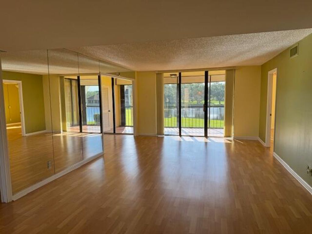 Photo of 5380 Woodland Lakes Drive #219, Palm Beach Gardens, FL 33418 (MLS # R10973360)