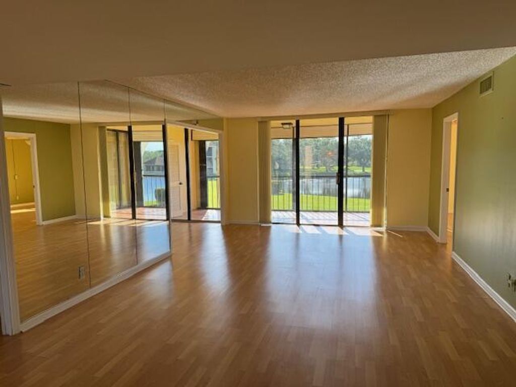 Photo of 5380 Woodland Lakes Drive #219, Palm Beach Gardens, FL 33418 (MLS # R10973360)