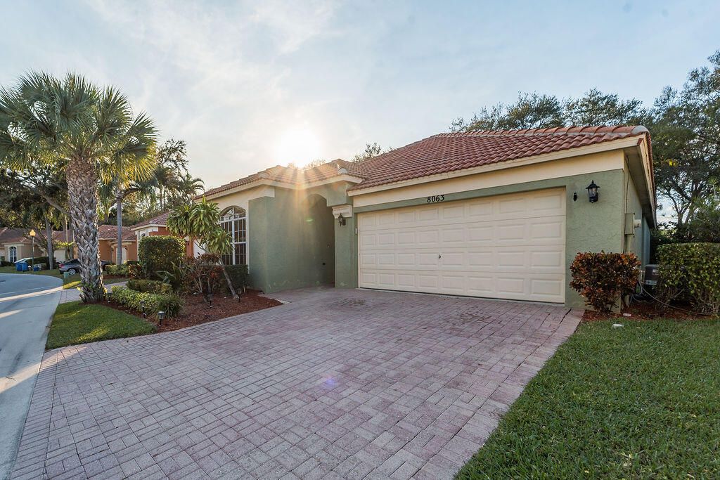 Photo of 8063 Via Hacienda, Riviera Beach, FL 33418 (MLS # R11159868)