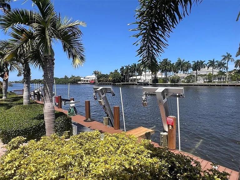 FURNISHED 6 MONTH RENTAL! Now offering this centrally located townhouse in "Waterside", an upscale waterfront community, convenient with shopping and restaurants just minutes away, and located only 5 mins to the beach! This spacious townhome comes fully furnished with 4 bedrooms, all with walk-in closets, and 3.5 baths. The huge primary bedroom has its own sitting area, and a primary bath that features a water closet, his & her sinks, and separate shower & roman tub. This dream home also includes all impact windows/doors, a full two car garage, an oversized kitchen with granite countertops, island with eat-in bar area, and a connecting dinning area w/ balcony. Waterside is a gated community featuring a first rate community pool resting right on the intracoastal for the best views around!