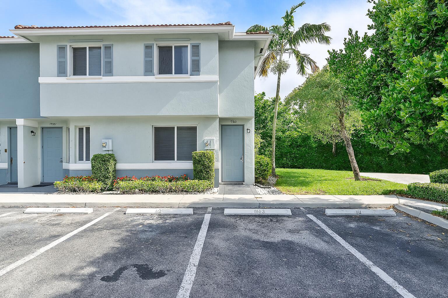 This well-maintained townhome in Riviera Beach offers the perfect combination of comfort and convenience. The bright and airy interior features a spacious open floor plan with a living room that flows directly into the dining area. The two-story layout includes beautiful wood-look laminate flooring on both levels with neutral beige walls throughout, creating a versatile canvas for any decorating style.