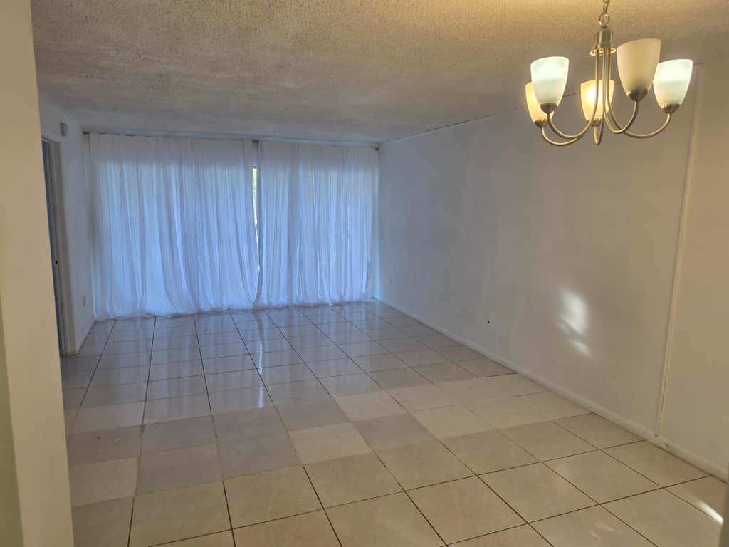 Photo of 661 N UNIVERSITY Drive #1-104, Pembroke Pines, FL 33024 (MLS # B26058112)