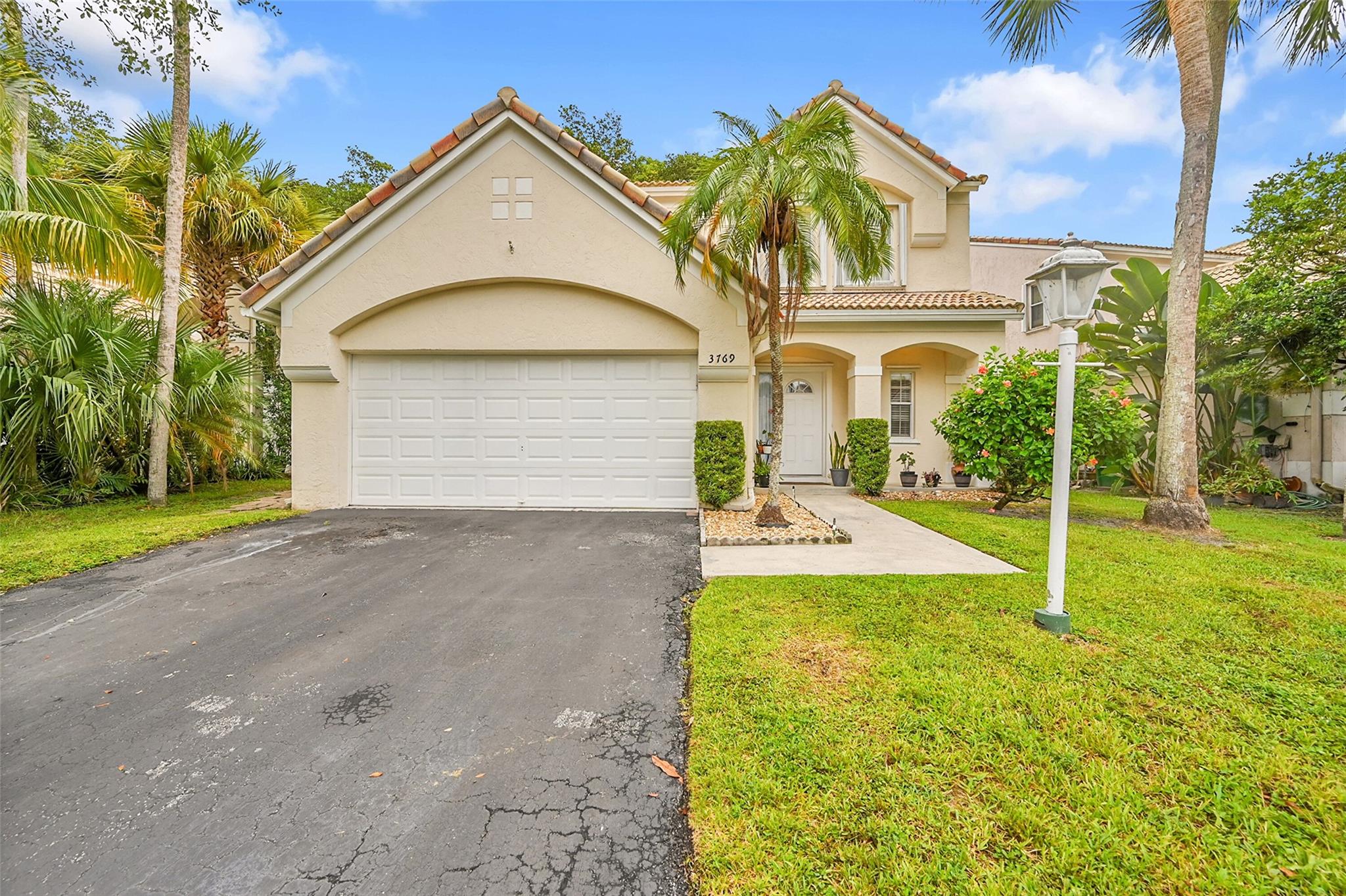 Beautiful 2-story home located in a gated community, ideally positioned near top-rated schools, shopping, dining, and with quick access to the Florida Turnpike. This spacious residence features an open, renovated kitchen with stainless steel appliances, vaulted ceilings, and a bright, airy layout. All bedrooms are conveniently located on the second floor, including a generous primary suite with a walk-in closet. The home also offers a 2-car garage, hurricane shutters/panels on all windows, and smart-home upgrades including Alexa/Siri-enabled Wiz & Hue lighting and an Ecobee thermostat. Additional highlights include a 2017 roof, 2025 water heater, 2011 A/C, and plenty of backyard space with fruit trees and room to add a pool. A perfect blend of comfort, convenience, and modern living!