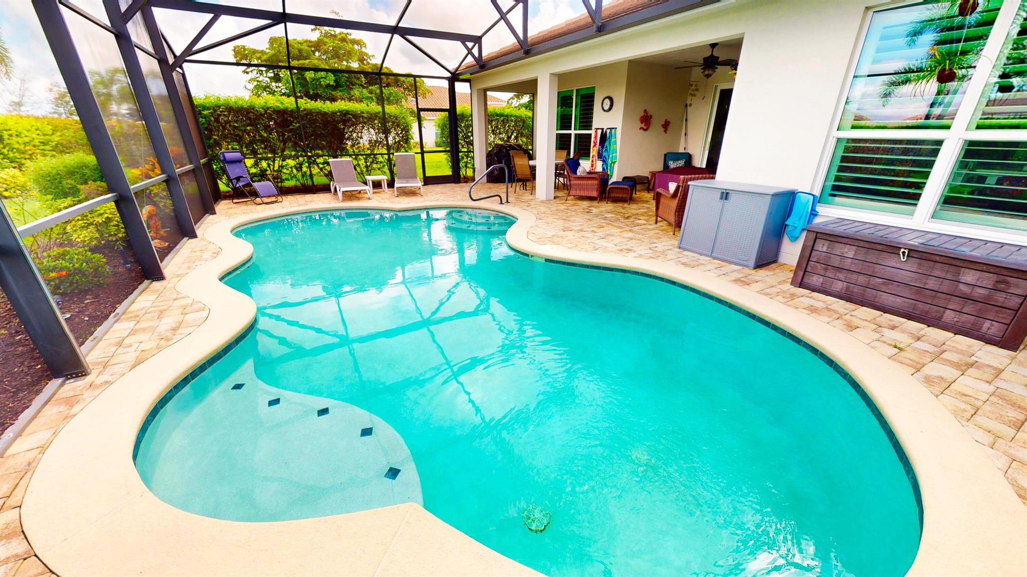 This beautifully upgraded 3-bedroom, 2.5-bath pool home with a den offers 2,446 square feet of elegant living space and includes a fully extended garage plus a golf cart garage. From the moment you enter, you'll appreciate the high-end finishes, including plantation shutters, stunning tile flooring, tray ceilings, crown molding, and impact windows, all under a durable tile roof. The spacious open-concept family room flows seamlessly into a gourmet kitchen featuring a large center island, dual wall ovens, a gas cooktop, and plenty of cabinetry--ideal for entertaining and daily living. The oversized master suite is a true retreat, complete with dual walk-in closets, his-and-her sinks, and a luxurious walk in shower.