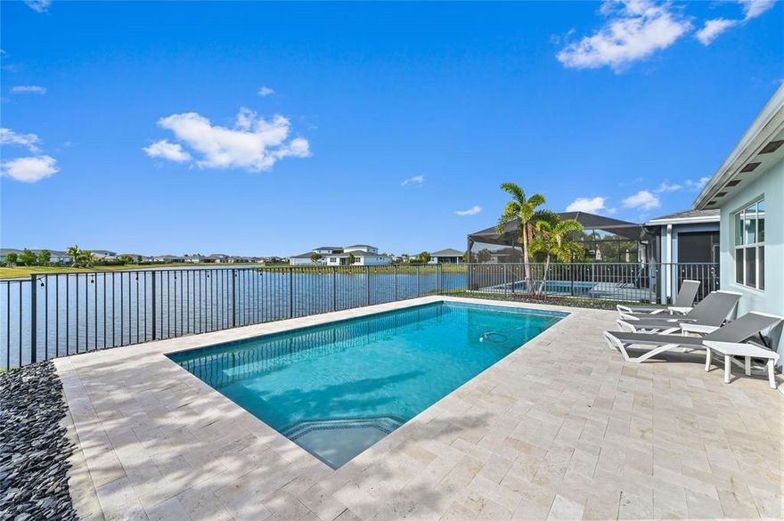 AMAZING sunsets to view from floating in your salt water-heated pool & screened back porch & fenced yard. This 3/2 w/laundry room & primary walk-in closet along w/spacious open concept w/stainless appliances & gas stove w/island area. Updated lighting - European custom curtains & blinds in bedrooms. HOA monthly payments include, Cable, Alarm, Internet, Lawn Care, and Sprinklers. GAS hot water heater and dryer and impact windows are more energy efficient. Garage epoxy floor-Furniture negotiable. Over $100K of upgrades. Amenity Center w/gym, tennis courts, dog park. Tradition shuttle to Tradition Square for dining & entertainment & Tradition Heart within walking distance for shopping & eating area. Cleveland Hospital close. New Tradition Regional Park and Stars & Stripe Park to open soon.