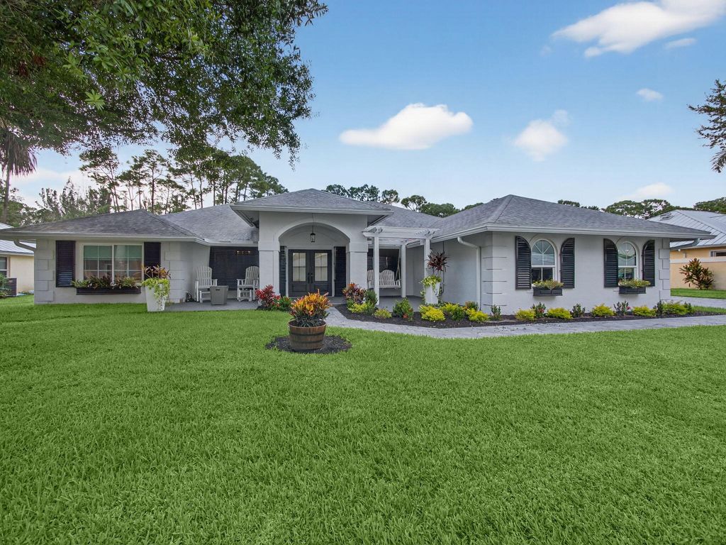 Photo of 8025 SW Yachtsmans Drive, Stuart, FL 34997 (MLS # R11127900)