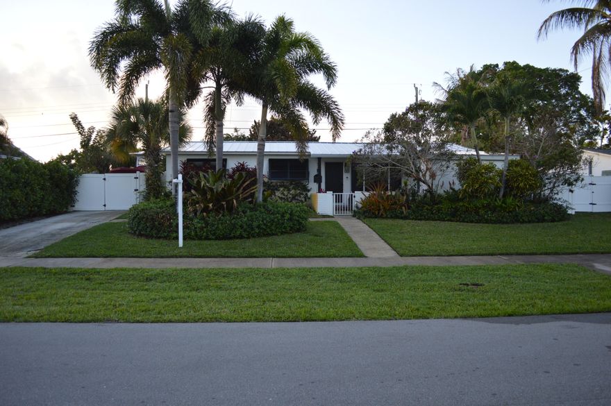 Beautifully updated 4/2 pool home in North Palm Beach. New metal roof in 2022. Updated kitchen with large island. Split unit AC in laundry room added in 2025. Updated bathrooms and flooring. Impact windows and doors. Large screened-in patio. Renovated laundry and storage room. Fully fenced in back yard with electric gate and parking for boat or RV on east side of home. Anchorage Park and Marina are steps away with dog parks and a boat ramp.