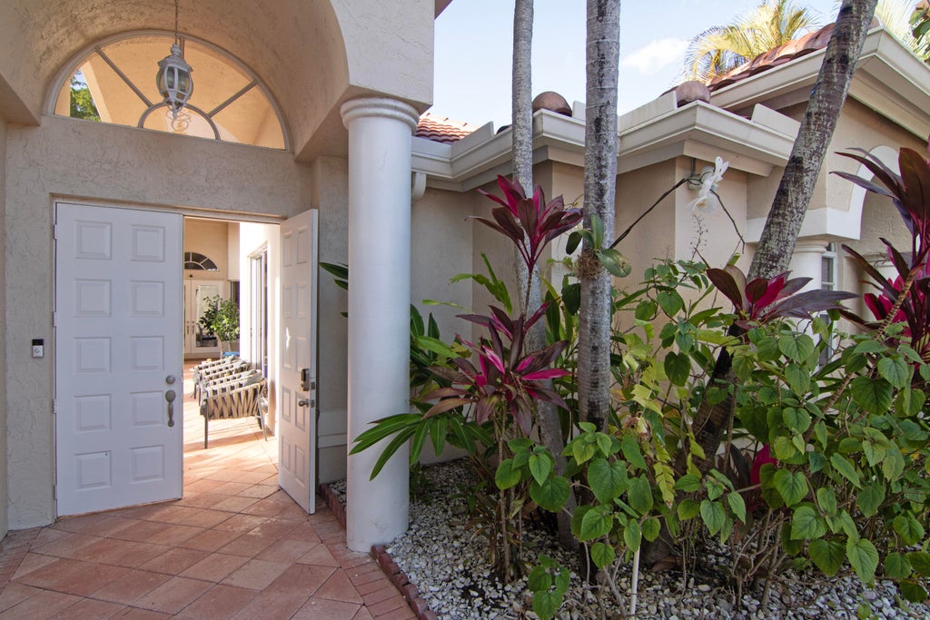 Photo of 10726 Greenbriar Villa Drive, Lake Worth, FL 33449 (MLS # B26044784)