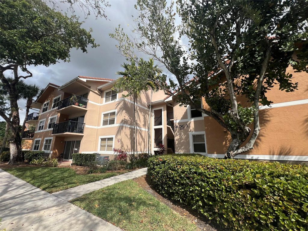 Photo of 8977 Wiles Road #206, Coral Springs, FL 33067 (MLS # B26023292)