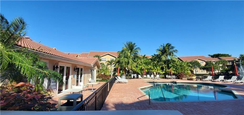 Photo of 8977 Wiles Road #206, Coral Springs, FL 33067 (MLS # B26023292)