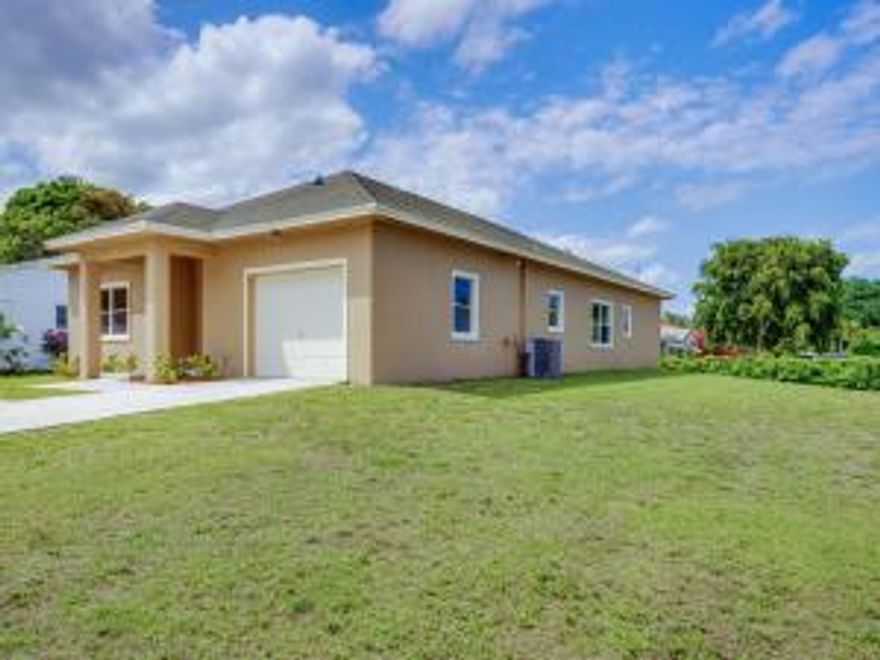 Huge 4 Bedroom home that sits on a corner lot that is almost 1/4 acre in size.  Built in 2001 this is one of the newer single family homes with no HOA in the neighborhood.  Just a 3 mile drive to free Gulfstream Park Public Beach.  Move-in ready with beautiful kitchen and bathrooms, Tile and Wood flooring throughout make it easy to clean.  One car garage has full size washer and dryer.  Spacious rear yard.  Easy access to I-95 and Downtown Delray Beach fun.