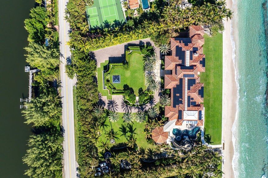 Ready for immediate occupancy. Magnificent Manalapan Modern Balinese inspired 2.83 acre estate, 34,498-square-foot full resort-style compound with unparalleled direct ocean views. Boasting 300+ feet of water frontage from ocean to Intracoastal making it one of the largest estates in Manalapan. Completely reimagined with recent upgrades and improvements including movie room, library, game rooms, wine room, ocean office, and several private lounges and flex spaces ensuring all needs are met.  Designed by the famed Marc-Michaels Interior Design Inc, this house comes fully custom furnished & turnkey!  This estate includes a total of 9 Bedrooms, 11.5 Baths, with 7 oceanfront suites and 2 lush guest garden suites. Both formal living room & family room have dramatic one of a kind 30ft floor to ceiling windows. A dedicated spa and wellness wing offers a gym, massage room, rain shower, and oceanfront yoga terrace. Outdoor highlights include expansive loggias, oceanfront balconies, a resort-style saltwater pool with waterfalls and waterslide, oversized spa, full outdoor kitchen, and lush tropical landscaping. A private deep-water dock provides direct ocean access via multiple inlets, completing this rare oceanfront and boating estate in prestigious Manalapan.  DISCLAIMER: Information published or otherwise provided by the listing company & its representatives is deemed reliable but not guaranteed are is subject to errors, omissions, or changes without notice. All information should be independently verified by any prospective buyer or seller. Listing company expressly disclaims any warranty or representation regarding such information.