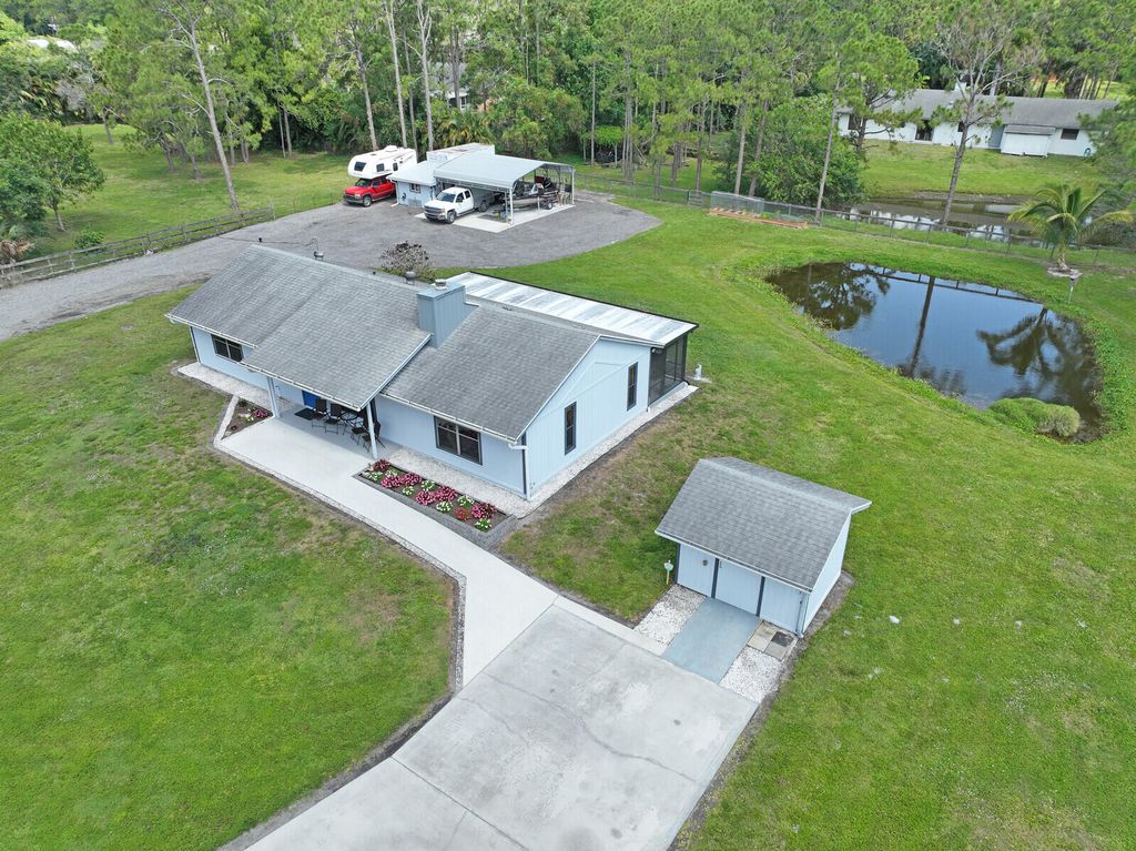 Photo of 16243 E Mayfair Drive, The Acreage, FL 33470 (MLS # R10977314)