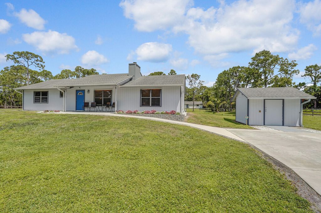 Photo of 16243 E Mayfair Drive, The Acreage, FL 33470 (MLS # R10977314)