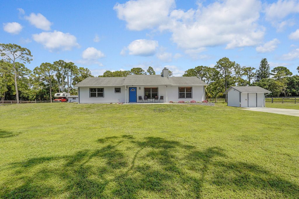 Photo of 16243 E Mayfair Drive, The Acreage, FL 33470 (MLS # R10977314)