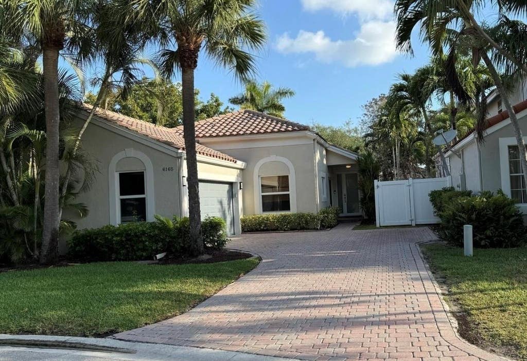 Photo of 6165 NW 77th Place, Parkland, FL 33067 (MLS # B26057223)