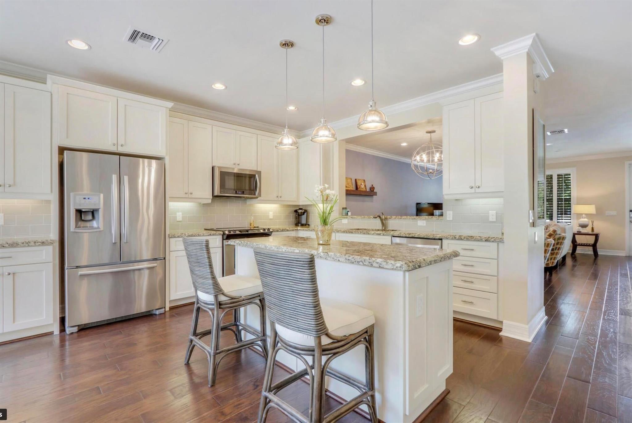 Nautica model townhome, 3 bed, 2.5 baths, a 2-car garage, and courtyard. Situated directly across from greenspace and tot lot.This home presents a host of desirable upgrades, including a newer AC, all wood floors, crown molding, and top-of-the-line appliances. Freshly painted in all white.TV brackets in the family room and all 3 bedrooms will remain for the new tenants.Take advantage of the resort-style community pool, state-of-the-art fitness center, community room, gas fire pit, and community grill, all within walking distance.Abacoa offers a vibrant lifestyle surrounded by shopping, dining, and just minutes away from the white sandy beaches of Jupiter. Enjoy downtown Abacoa outdoor concerts, food truck nights, festivals and baseball at Roger Dean Stadium.