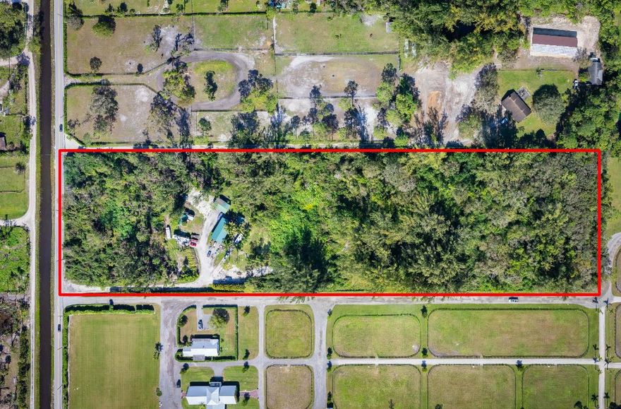 Amazing location, South of Okeechobee Blvd, old florida living, blank palette to build your family compound, horse farm, agricultural retreat, the options are endless. Large metal building to fit RV under, separate 3 car garage, shed,  2 ponds, electric, water and septic on site
