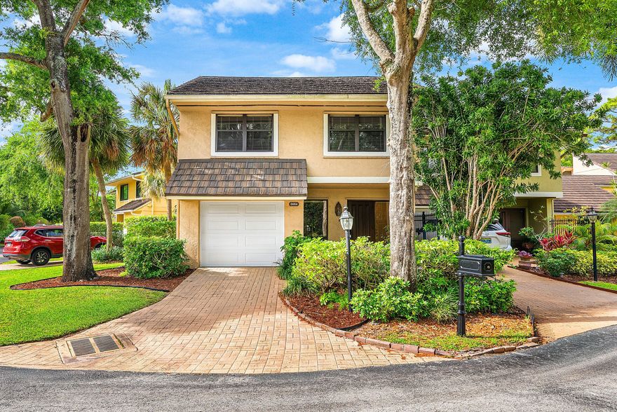 Beautifully maintained 3-bedroom, 2.5-bath townhouse in the desirable Brook Haven community of Boca Raton a small, quiet enclave of 25 homes nestled in a residential area. This spacious two-story residence offers nearly 2,000 square feet of living space, featuring an open living and dining area with vaulted ceilings, a cozy fireplace, and an airy layout ideal for both relaxing and entertaining.  Upstairs, the primary suite includes a private balcony, a walk-in closet, and a well-appointed en-suite bath. Additional bedrooms are perfect for family, guests, or a home office.  As a desirable end unit, this home offers additional yard space and enhanced privacy, creating an open, peaceful setting. The fully fenced backyard and garden/patio space are ideal for outdoor living, morning coffee, or  evening gatherings. Additional features include a one-car garage, in-unit washer and dryer, low HOA dues, and access to the community pool. Conveniently located near shopping, dining, beautiful beaches, and golf courses, as well as Boca Town Center Mall, top-rated schools, and nearby universities.