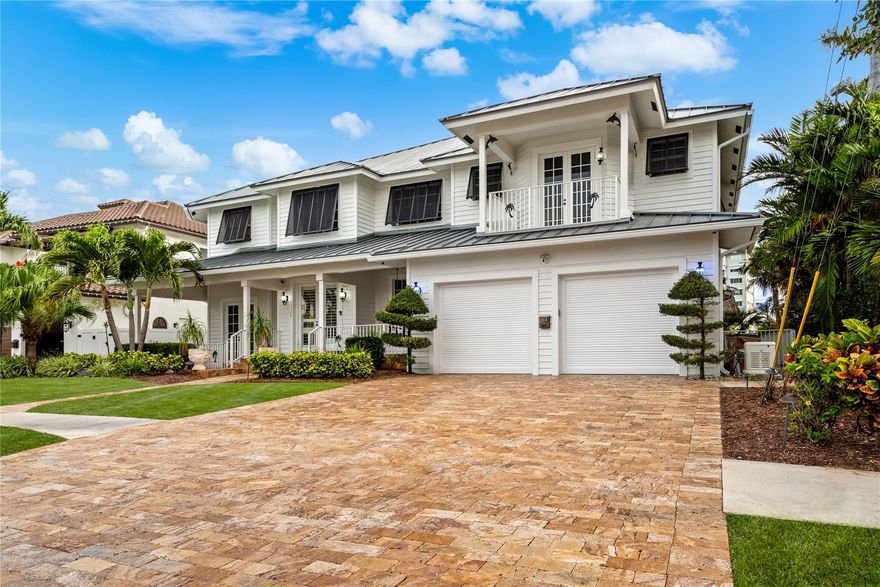 This airy split-plan lifestyle residence offers the utmost in personal privacy, luxury and serenity. Thematically designed to transport you, it provides exceptional waterway views, a two-story entry foyer with sweeping wood staircase, an inspired coquina living room fireplace, rich hardwood bedroom floors, weathered wood-look custom cabinetry, a covered lanai by a waterside pool with spillover spa, all defined by travertine pavers, Bahamian shutters, and its very own Tiki hut. The avid boater will enjoy a full-service private dock with 10,000± pound boatlift and easy ocean access through the Boca Raton and Hillsboro Inlets. The newly refinished resort-style pool/spa, and covered lanai with full summer kitchen ensure waterfront alfresco dining and easy entertaining.