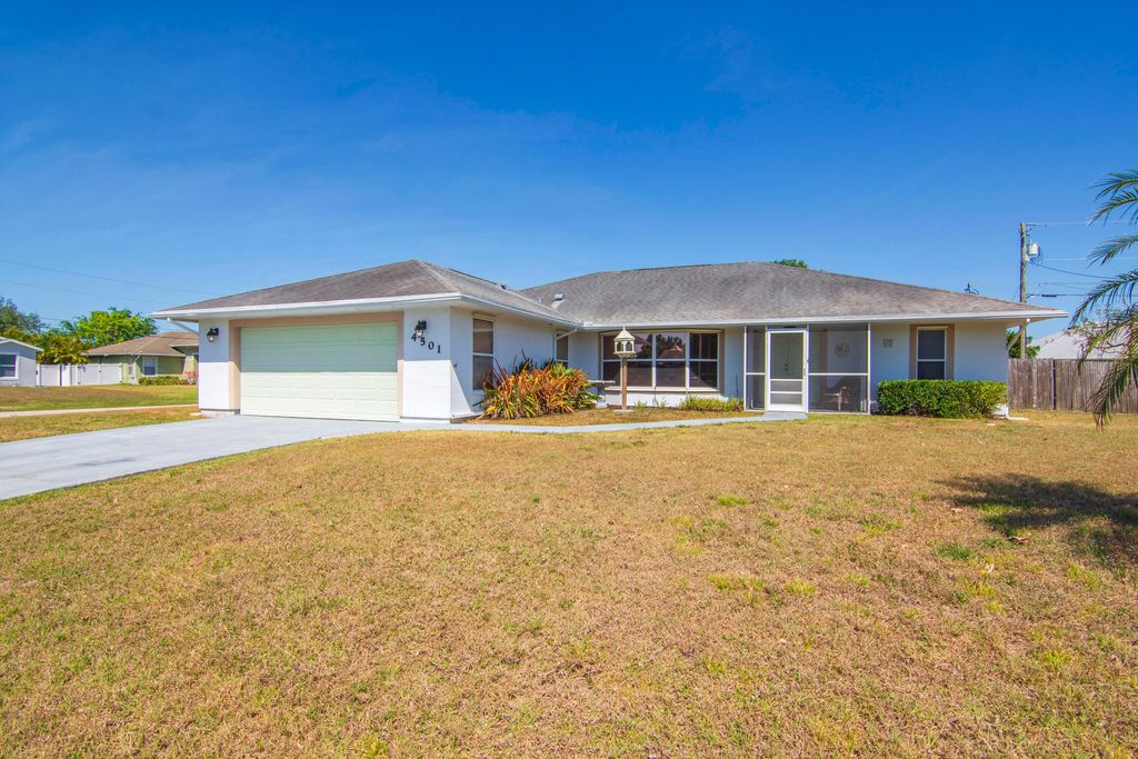 Photo of 4501 SW Floral Street, Port Saint Lucie, FL 34953 (MLS # R10977779)
