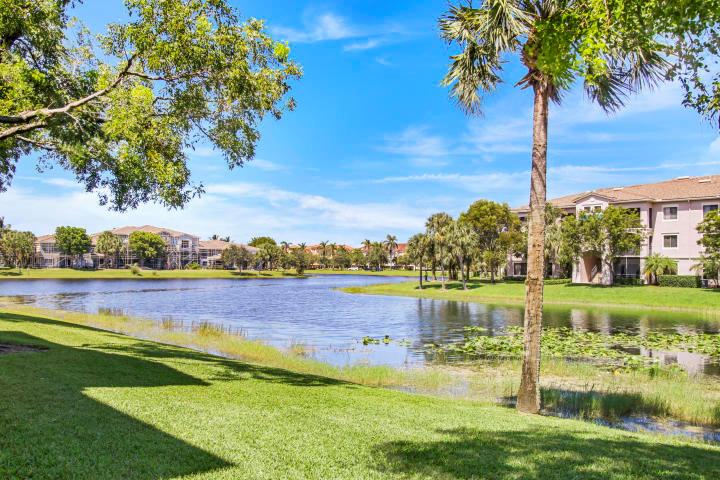 First floor one bedroom home with panoramic water views.Newer AC. NO carpet. Washer and Dryer in unit. From the moment you enter the spacious entry foyer you will immediately realize it is all about the water, gracious living and the perfect south Florida home. The generous floor plan offers the perfect Florida lifestyle in the gated community of San Matera. The Tivoli model is the largest one bedroom unit in the community and has been tiled throughput by the current owner. The close proximity to The Gardens Mall and all those restaurant and shops along PGA Boulevard is icing on the cake The beaches and freeways are super close and just minutes to Palm Beach International Airport. Location, location, location. Water, Sewer & Trash INCLUDED. Financial requirements. Credit 675 or greater.
