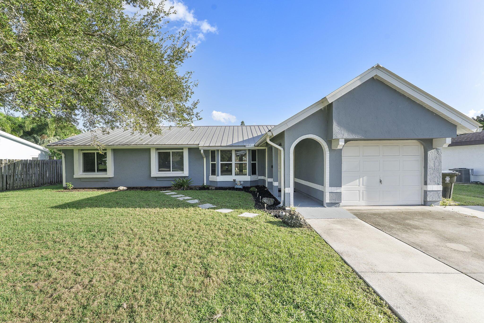 Welcome to this beautifully updated 3-bedroom, 2-bath gem perfectly situated in the heart of Port Saint Lucie. Combining modern style with everyday comfort, this home offers a bright, open layout that feels both inviting and spacious ideal for relaxing or entertaining guests.The stunning kitchen is the centerpiece of the home, featuring sleek quartz countertops, stainless steel appliances, and abundant cabinet space for all your culinary essentials. Whether you're hosting a dinner party or enjoying a quiet meal at home, this space is designed to impress.