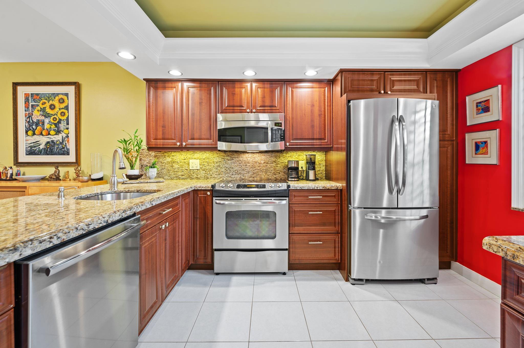 KING 2 BED-2 BATH BEAUTIFULLY REMODELED CORNER CONDO ON OAKS CLUBHOUSE DR. B-76!! Tastefully presented and appointed featuring a spacious open kitchen w/stainless appliances and wood cabinets, new impact windows and doors, plantation shutters, custom closets, marble bathrooms, smooth ceilings, white tile floors throughout condo and balcony, carpet in bedrooms, newer a/c, washer/dryer. Presented in spotless, meticulous condition. Large custom designed storage for maximum capacity. Front parking with endless guest spaces. Building is up to date, freshly painted, paved parking lots and steps to pools, tennis & park! Budget, reserves, inspections and studys are on target with Campbell Mgt. By the way did I say LOW MAINTENANCE FEE!! This is a must see in person so call for a fantastic showing!!