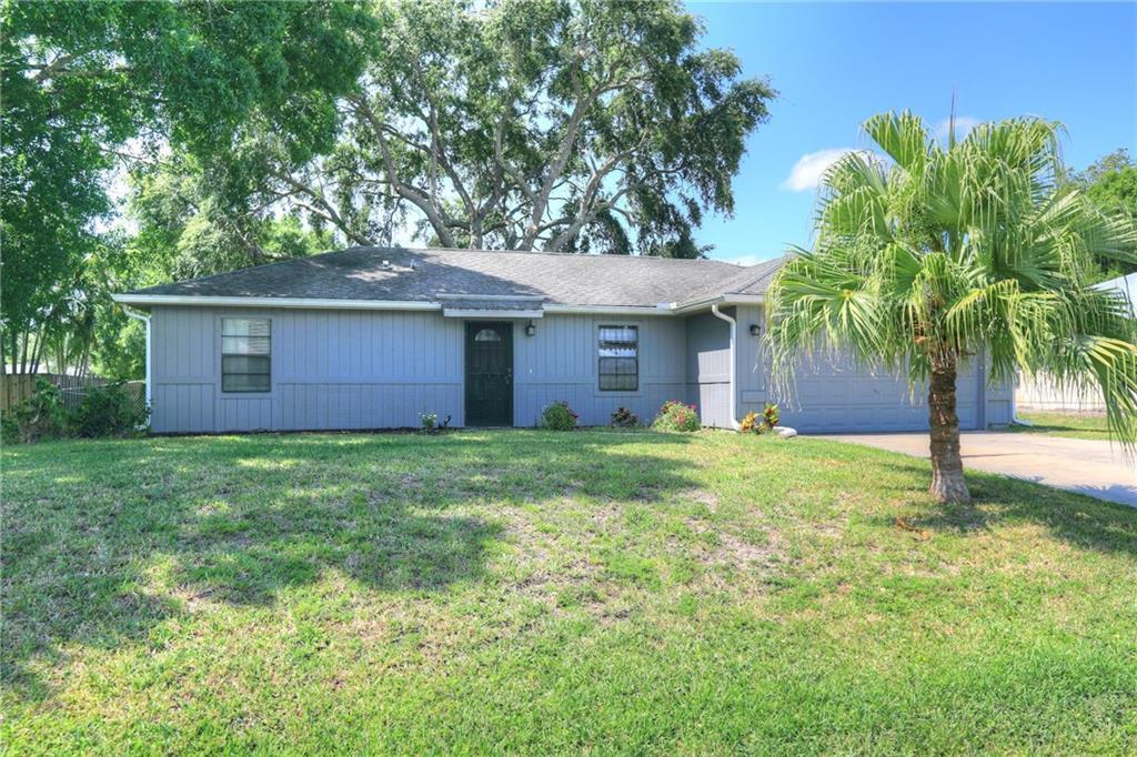 MOTIVATED SELLERS - BRING AN OFFER! Charming 3BR/2BA home in desirable Sebastian Highlands featuring cathedral ceilings, a split floor plan, laminate floors in the main living areas and two bedrooms, tiled baths, and a breakfast bar. Enjoy the large, fenced backyard with plenty of room for a pool. Includes whole-house water filtration system and spacious 2-car garage. Located in a quiet neighborhood with no HOA.